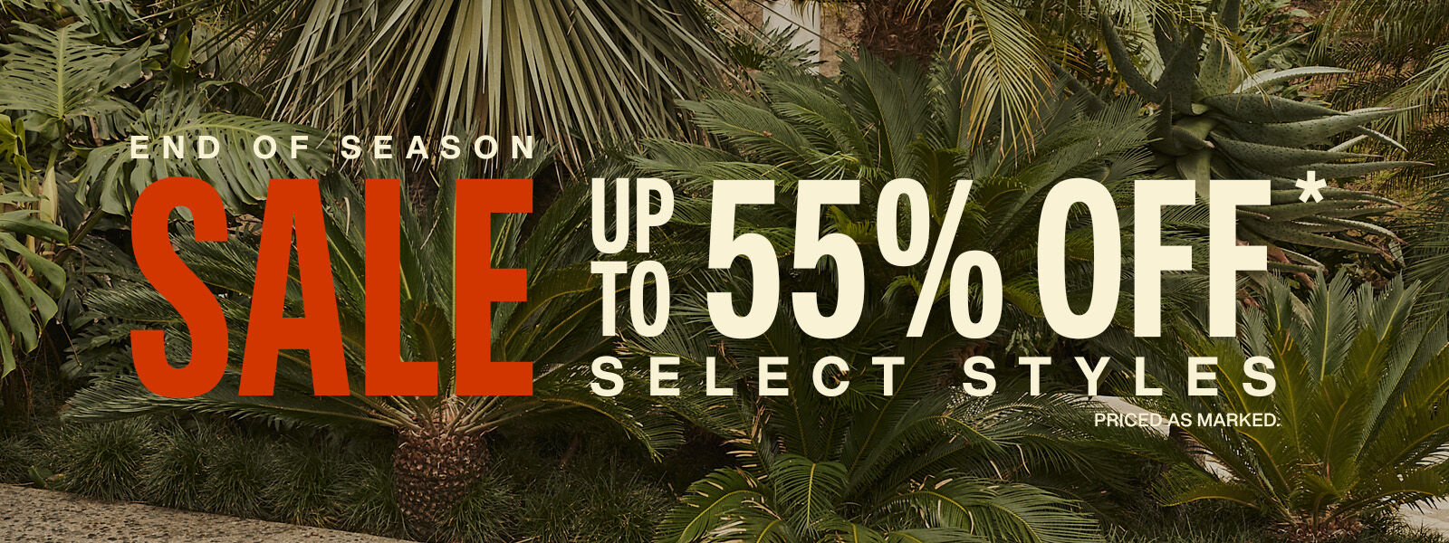 Banner with a background of green palm trees with the words End of Season Sale up to 55% Select Styles